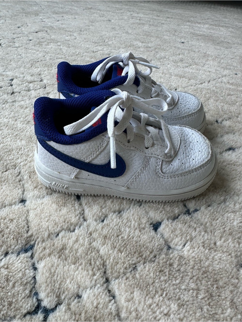 Nike Kids White Sneakers with Navy Blue Swoosh